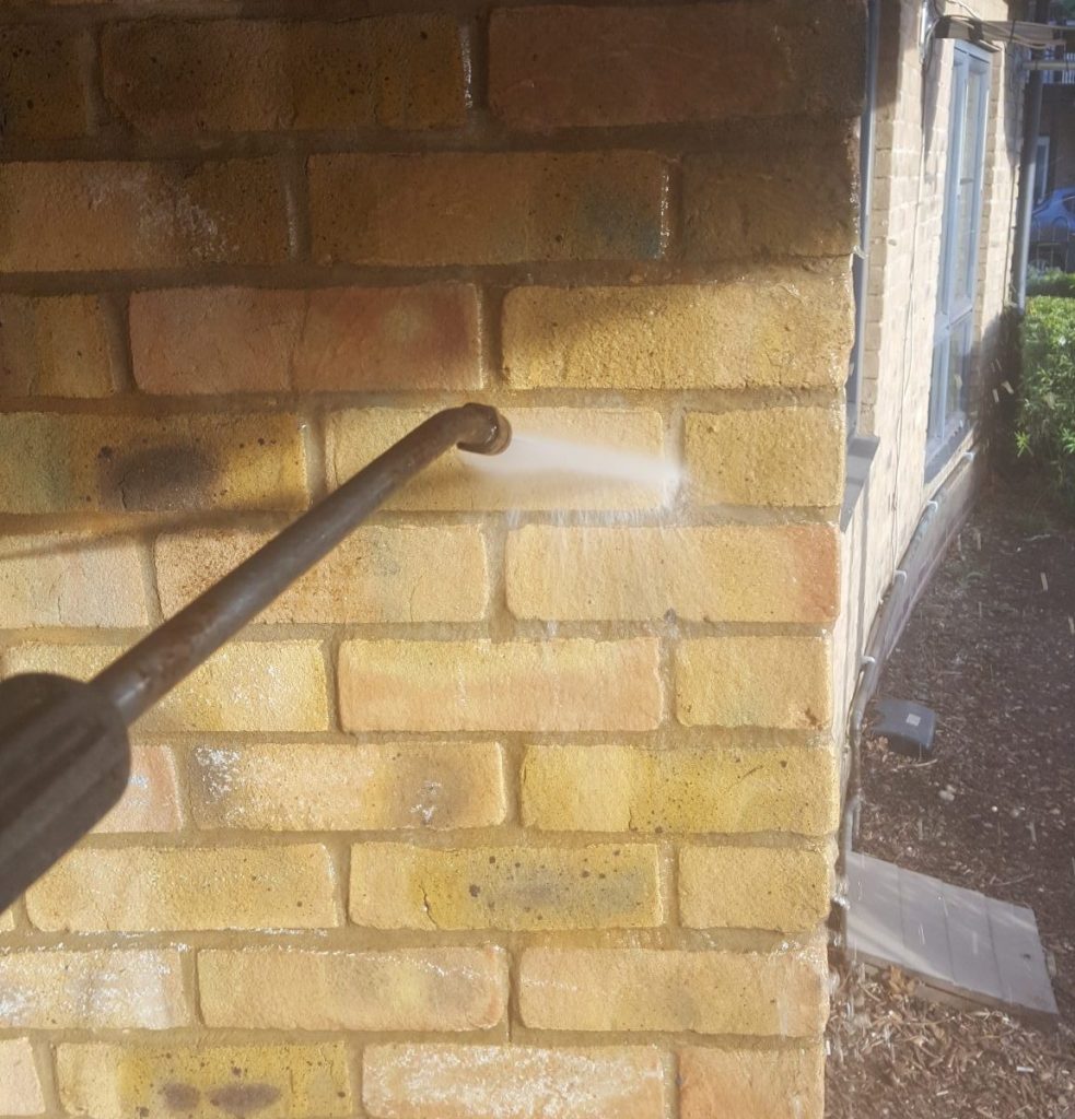Pressure washer cleaning residential and commercial properties