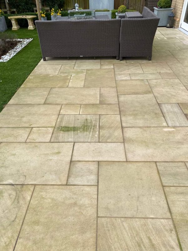 Back garden slabs pressure washed in London