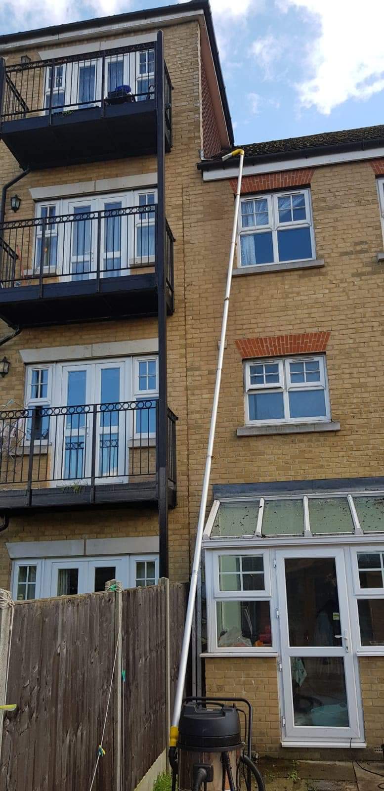 Gutter pole cleans 4 story high house in London