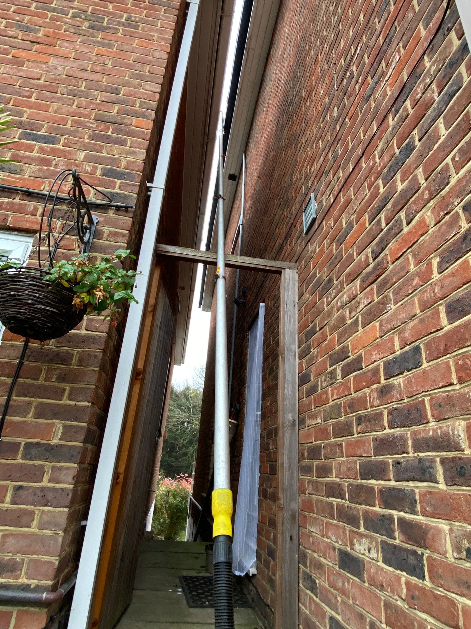 Specialist pole used for cleaning gutters around London