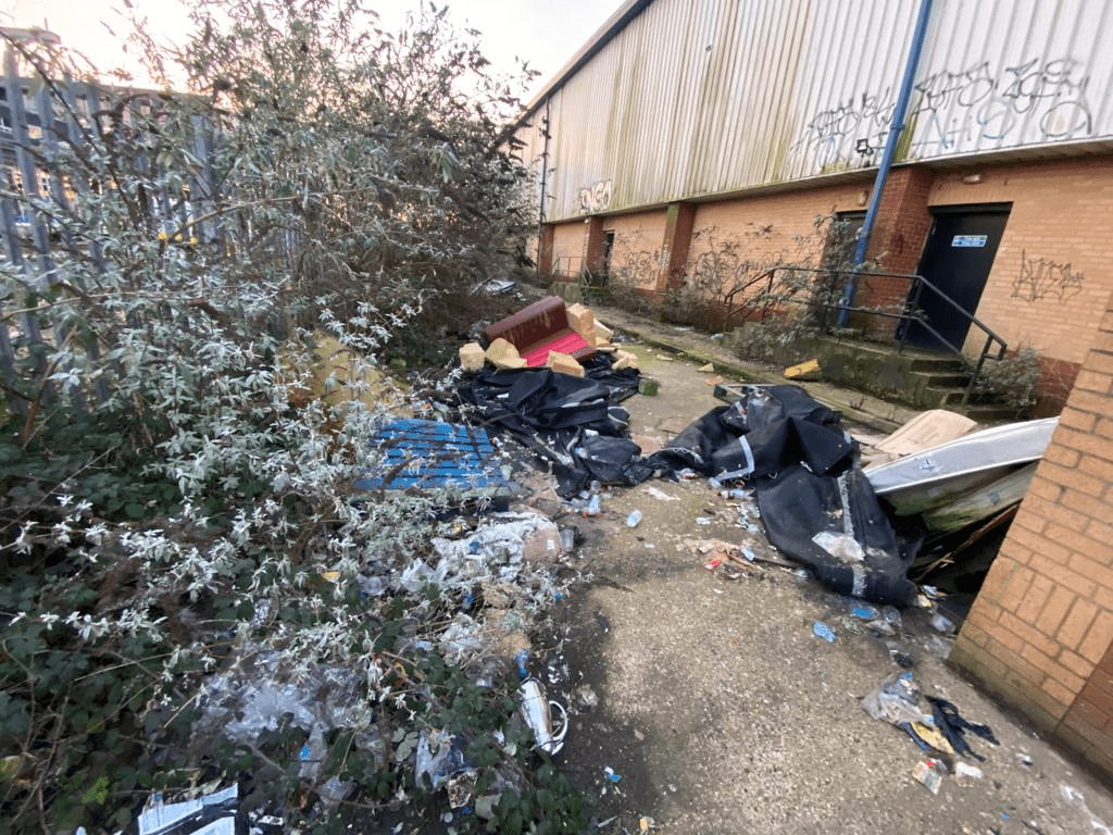 unkept commercial bin storage in London