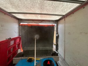 commercial bin cleaning in the back of van
